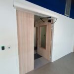 Automatic swing door system installed by Technologie Hilios Inc. – modern European automatic door for office or healthcare facility in Montreal.